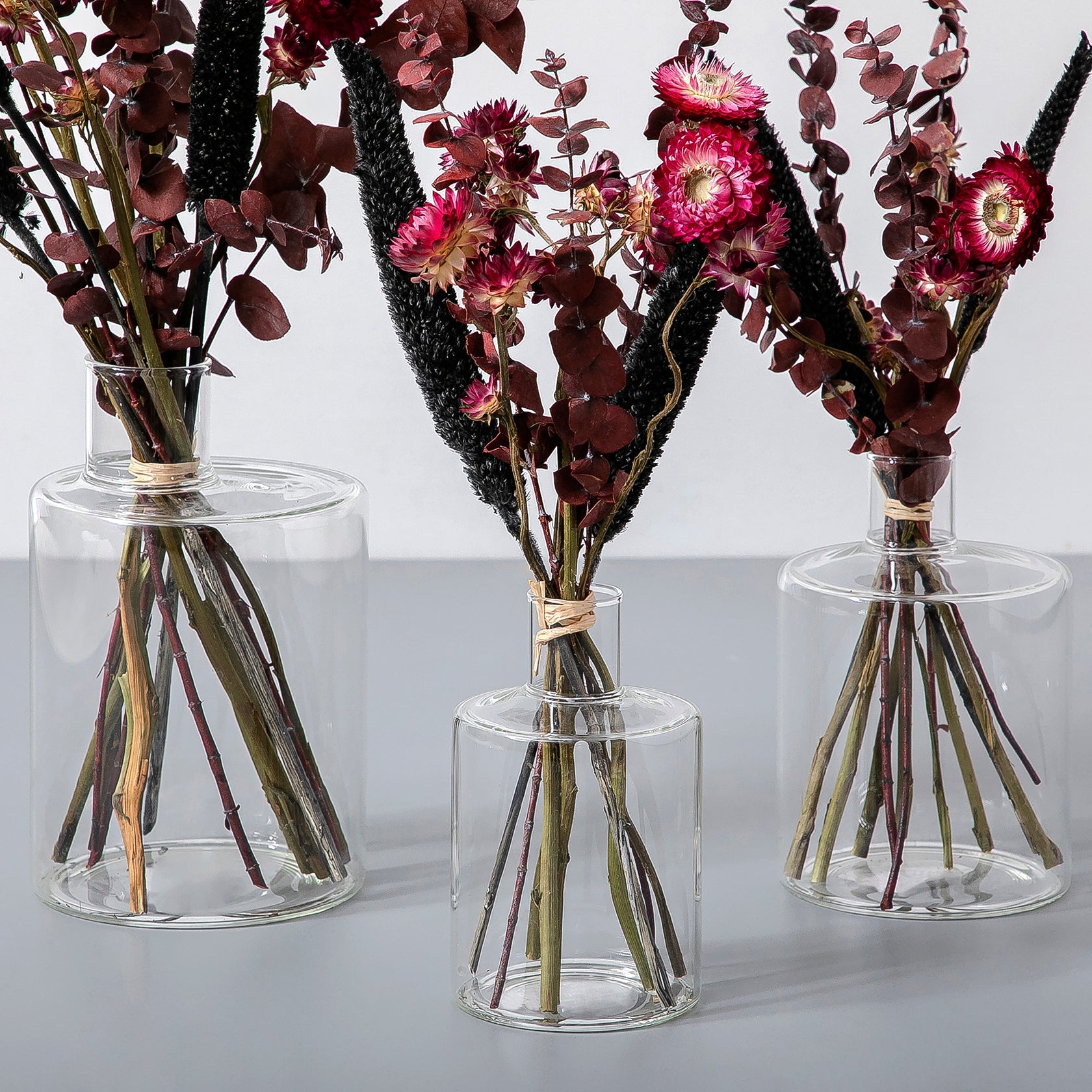 Set of dried flowers with glass vases