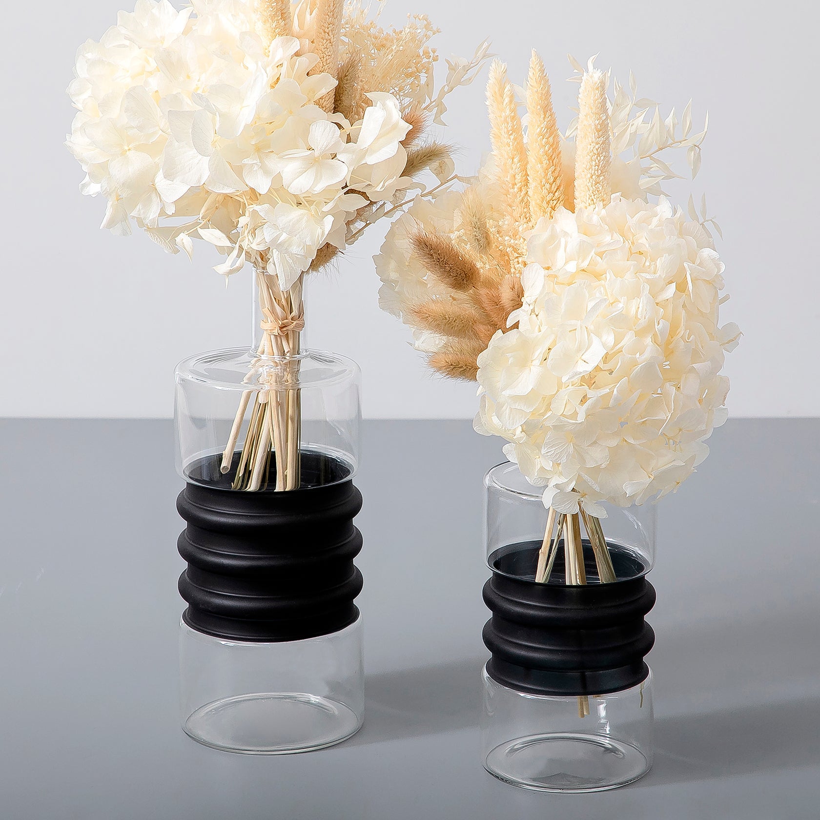 Set of dried flowers with glass vases